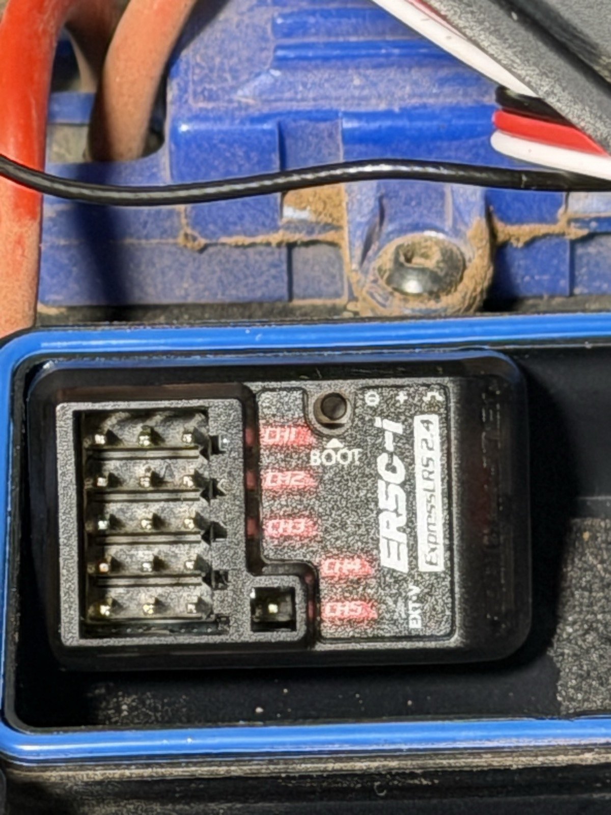 RadioMaster ER5C-i receiver, showing channel labels CH1 through CH5, a BOOT button, an EXT-V two-pin header, and five shrouded three-pin headers